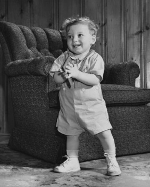 Baby boy standing and holding a picture frame Poster Print - Item # VARSAL2559341B