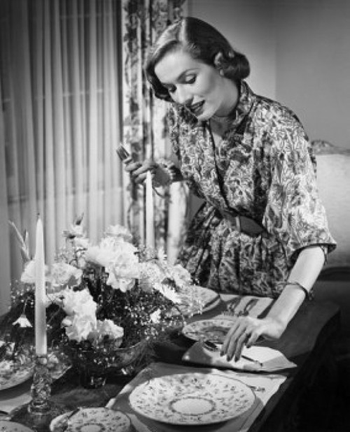 Young woman setting table for dinner Poster Print - Item # VARSAL25541996