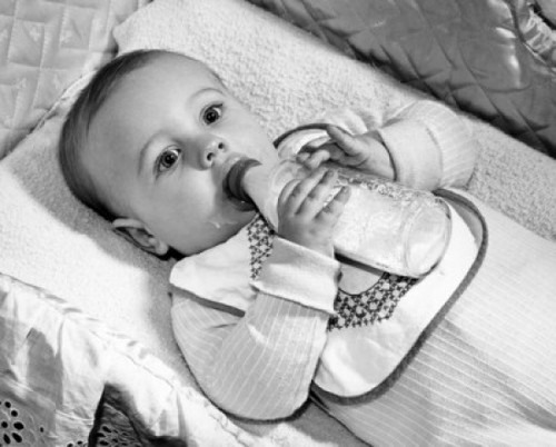 Baby drinking milk from baby bottle Poster Print - Item # VARSAL2559611
