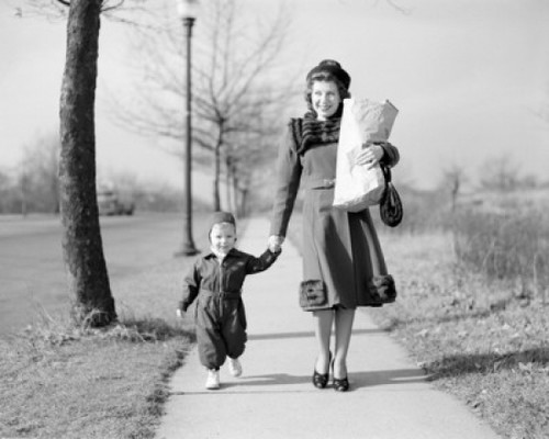 Mother walking with baby daughter along footpath  carrying shopping Poster Print - Item # VARSAL255416316