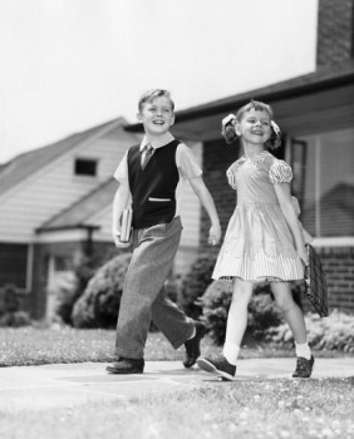 Schoolboy and schoolgirl walking on foorpath and smiling Poster Print - Item # VARSAL25517746 Schoolboy and schoolgirl walking on foorpath and smiling Poster Print - Item # VARSAL25517746