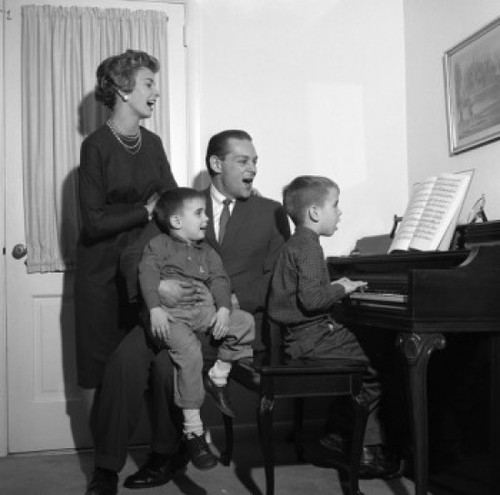 Family signing by with boy playing piano Poster Print - Item # VARSAL255418071