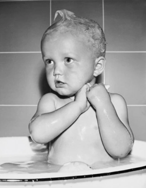Baby in a bathtub Poster Print