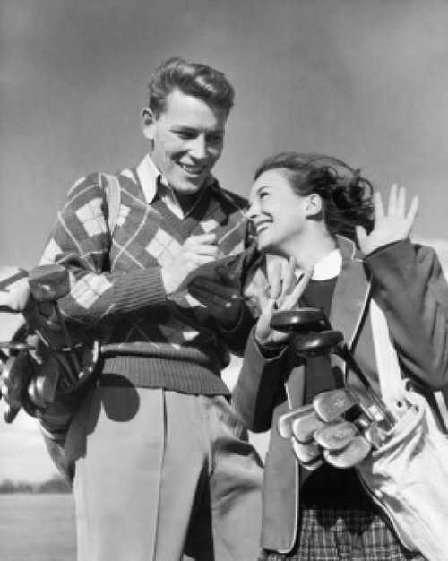 Low angle view of a young couple with golf clubs Poster Print - Item # VARSAL2554082