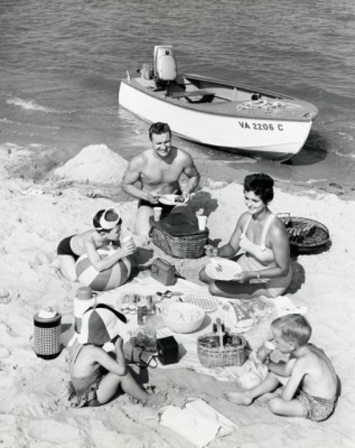 Parents with three children having picnic on beach Poster Print - Item # VARSAL25519312