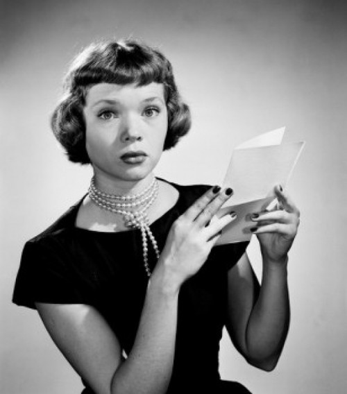 Portrait of young woman holding letter Poster Print - Item # VARSAL255417981
