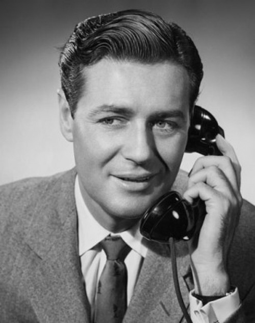 Mid adult businessman using telephone Poster Print - Item # VARSAL25548262