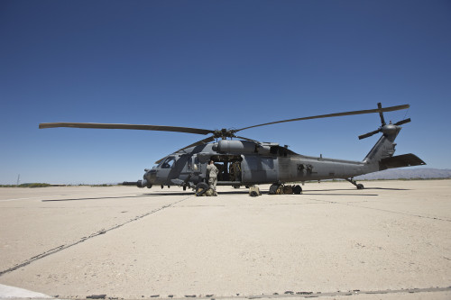 HH-60G Pave Hawk with pararescuemen at Davis-Monthan Air Force Base during exercise Angel Thunder 2013 Poster Print - Item # VARPSTTMO101072M