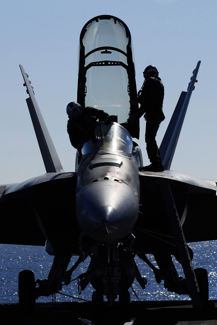Pacific Ocean, January 23, 2007 - Pilots conducts a pre-flight inspection on an F/A-18F Super Hornet on the flight deck aboard the Nimitz-class aircraft carrier USS John C. Stennis. Poster Print - Item # VARPSTSTK102110M