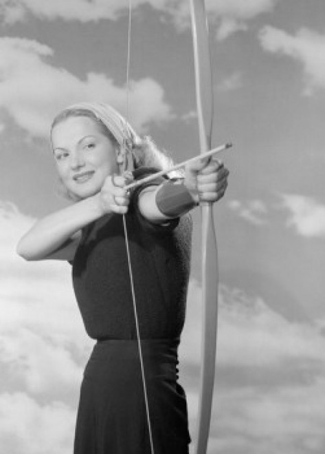 Young woman aiming bow and arrow outdoors Poster Print - Item # VARSAL255418827