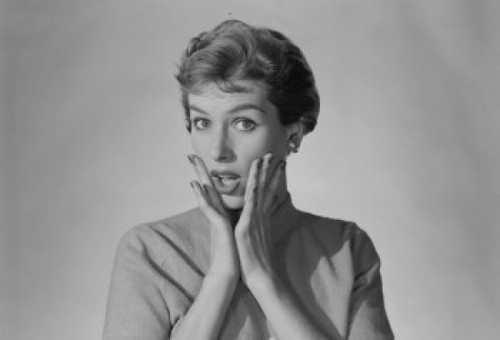 Studio portrait of young woman with head in hands Poster Print - Item # VARSAL255422851