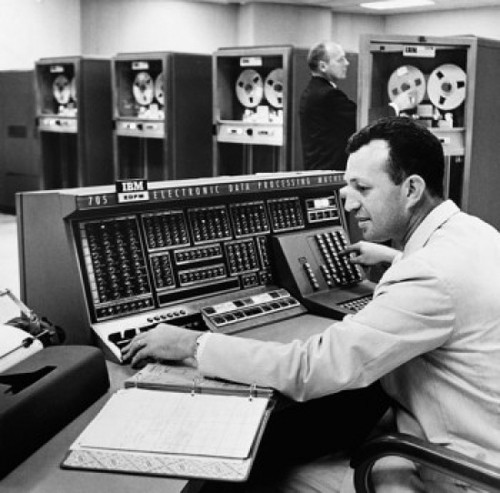 Side profile of a mid adult man operating a computer Poster Print - Item # VARSAL2556925