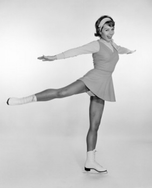Studio portrait of young woman ice skating Poster Print