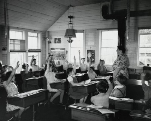 Group of students raising their hands in a classroom Poster Print - Item # VARSAL25515797