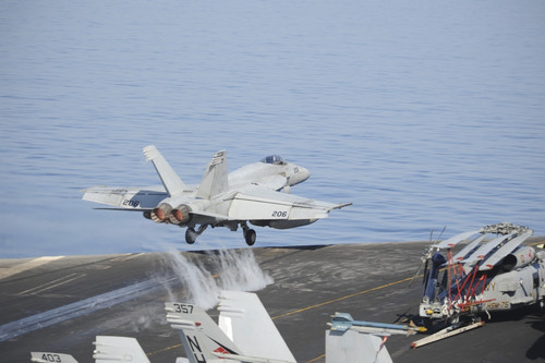 Mediterranean Sea, October 25, 2013 - An F/A-18E Super Hornet launches from the aircraft carrier USS Nimitz. Poster Print - Item # VARPSTSTK108069M