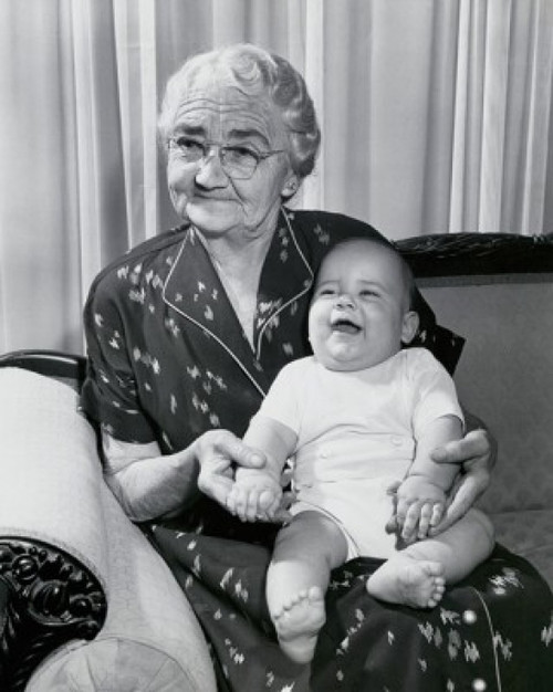 Close-up of a grandmother sitting on a couch with her grandson on her lap Poster Print - Item # VARSAL25520073