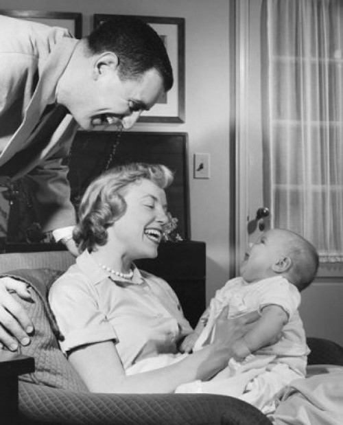 Mid adult couple with their son smiling Poster Print - Item # VARSAL2555922