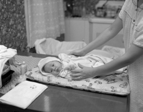 Mother nursing baby on table Poster Print - Item # VARSAL2559201