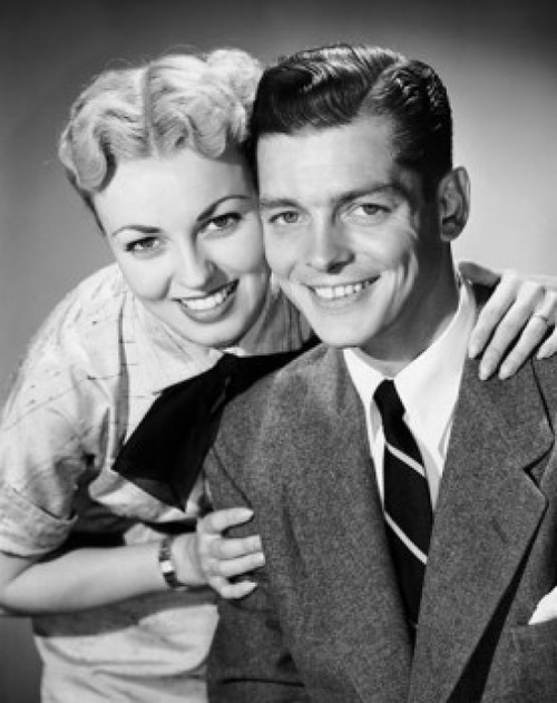 Portrait of a mid adult woman embracing a mid adult man from behind Poster Print - Item # VARSAL2552991