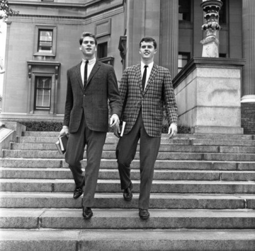 Two well dressed young men going down on stairs Poster Print - Item # VARSAL255417414
