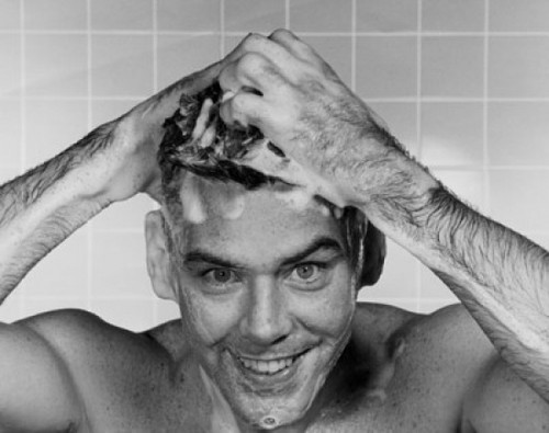 Close-up of a young man washing his hair Poster Print - Item # VARSAL25527330B