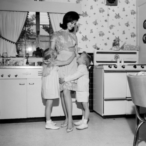Mother embracing children in kitchen Poster Print - Item # VARSAL255417656