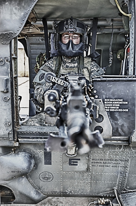 High dynamic range image of a UH-60 Black Hawk door gunner manning a M240B machine gun, Tikrit, Iraq Poster Print - Item # VARPSTTMO100739M