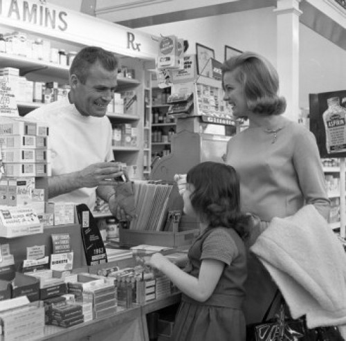 Mother and daughter shopping at chemists Poster Print - Item # VARSAL255421051