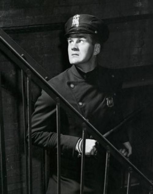 Policeman standing near a staircase Poster Print - Item # VARSAL25525453