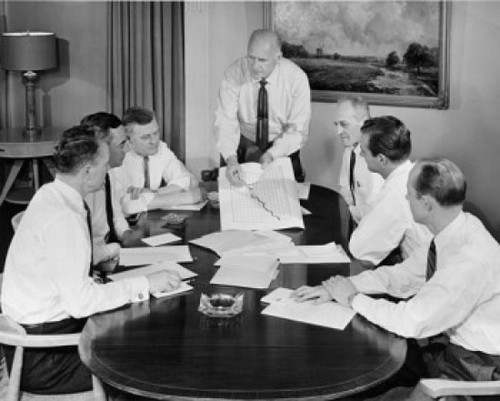 Business executives discussing chart in conference room Poster Print - Item # VARSAL25548708