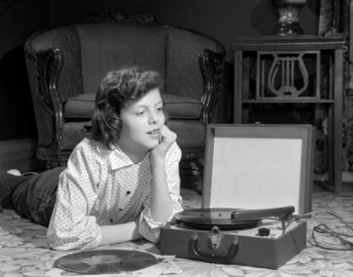 Girl listening to record player on floor in home Poster Print - Item # VARSAL2552591