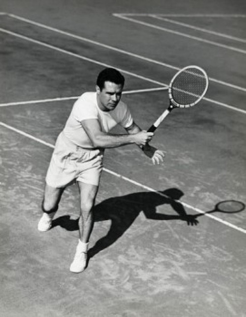Young man playing tennis on tennis court Poster Print - Item # VARSAL25549950