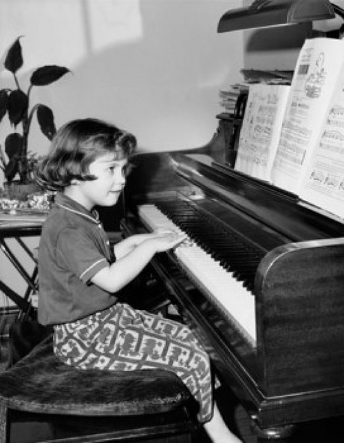 Girl playing a piano Poster Print - Item # VARSAL25514253
