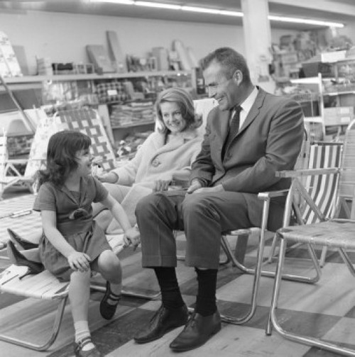 Mother and father with daughter testing deck chairs in shop Poster Print - Item # VARSAL255421029