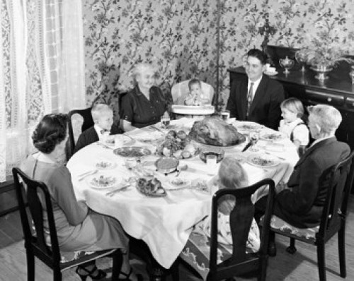 Family at a dining table on Thanksgiving Day Poster Print - Item # VARSAL25539894