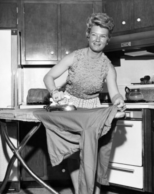 Portrait of a young woman ironing clothes Poster Print - Item # VARSAL25519079