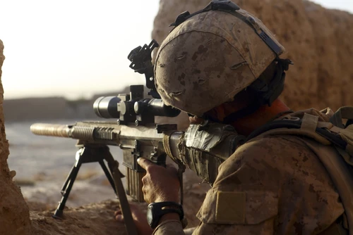U.S. Marine looks through the scope of his M16A4 rifle for enemy forces Poster Print - Item # VARPSTSTK104431M