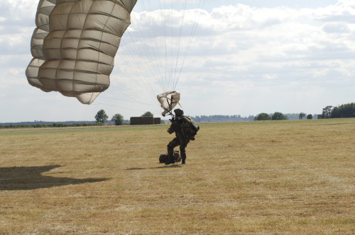 A member of the Pathfinder Platoon collapses his parachute after a HALO jump Poster Print - Item # VARPSTACH100013M