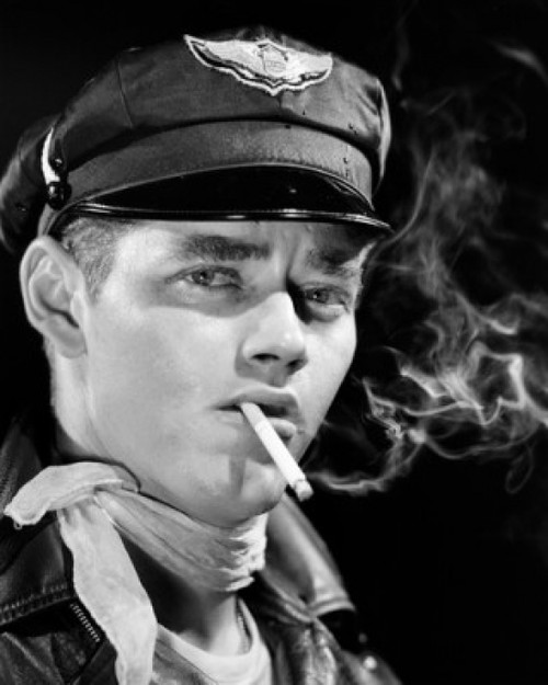 Studio portrait of young man smoking cigarette Poster Print - Item # VARSAL25537573