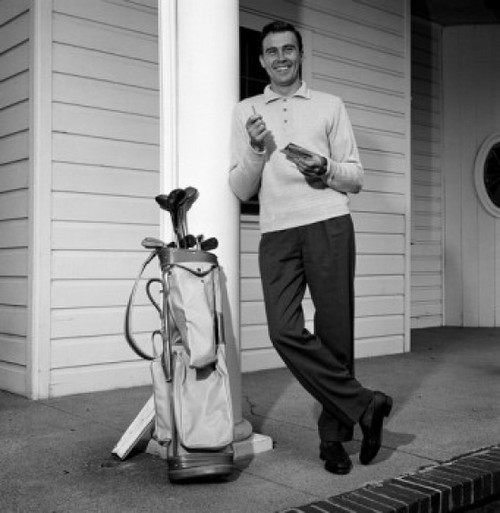 Mid adult man leaning against column with golf trolley beside Poster Print - Item # VARSAL255417152