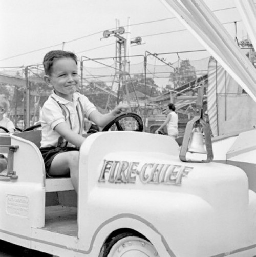 Boy in amusement park Poster Print - Item # VARSAL255418310