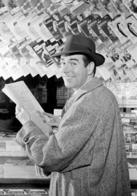 Man reading newspaper in kiosk Poster Print - Item # VARSAL255417015