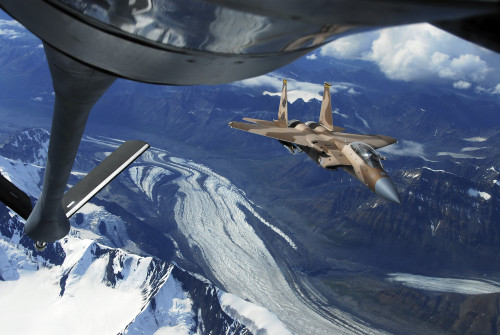 A U.S. Air Force F-15C Eagle positioning itself behind a KC-135R Stratotanker over Alaska Poster Print - Item # VARPSTSTK103209M