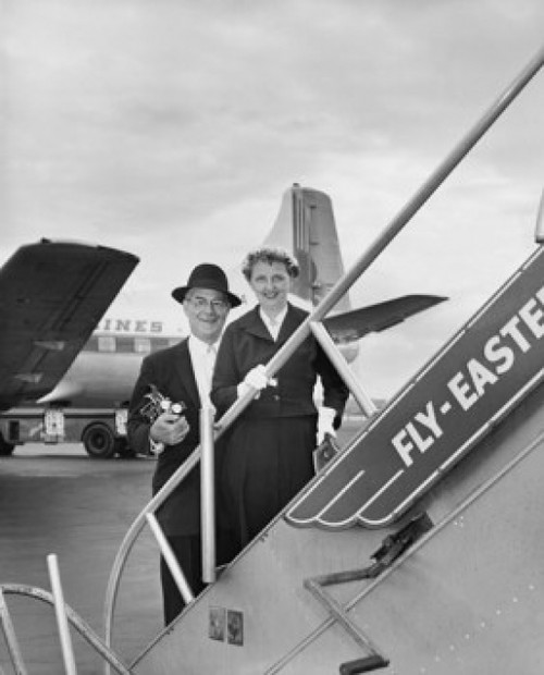 Senior couple standing on the staircase of an airplane Poster Print - Item # VARSAL2555929B