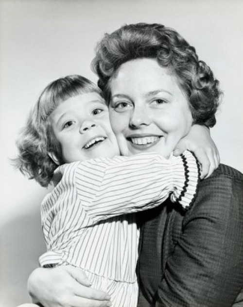 Portrait of a mid adult woman smiling with her daughter Poster Print - Item # VARSAL25519971