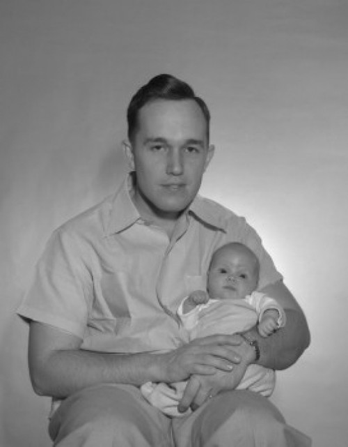 Portrait of a father holding his baby Poster Print - Item # VARSAL2559770