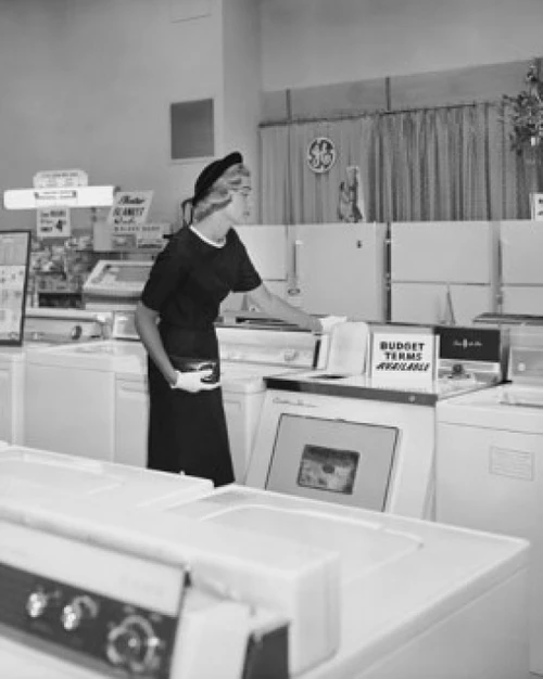 Young woman standing in a store Poster Print - Item # VARSAL255387