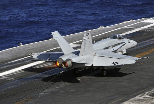 Pacific Ocean, December 24, 2011 - An F/A-18C Hornet lands on the flight deck of the Nimitz-class aircraft carrier USS Abraham Lincoln. Poster Print - Item # VARPSTSTK105193M