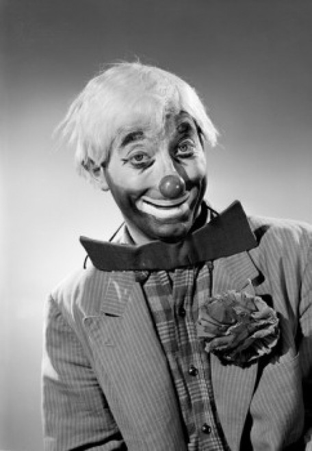 Studio portrait of clown smiling Poster Print