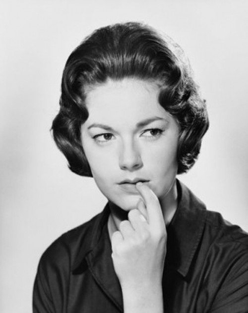 Close-up of a young woman with her finger in her mouth Poster Print - Item # VARSAL25550191